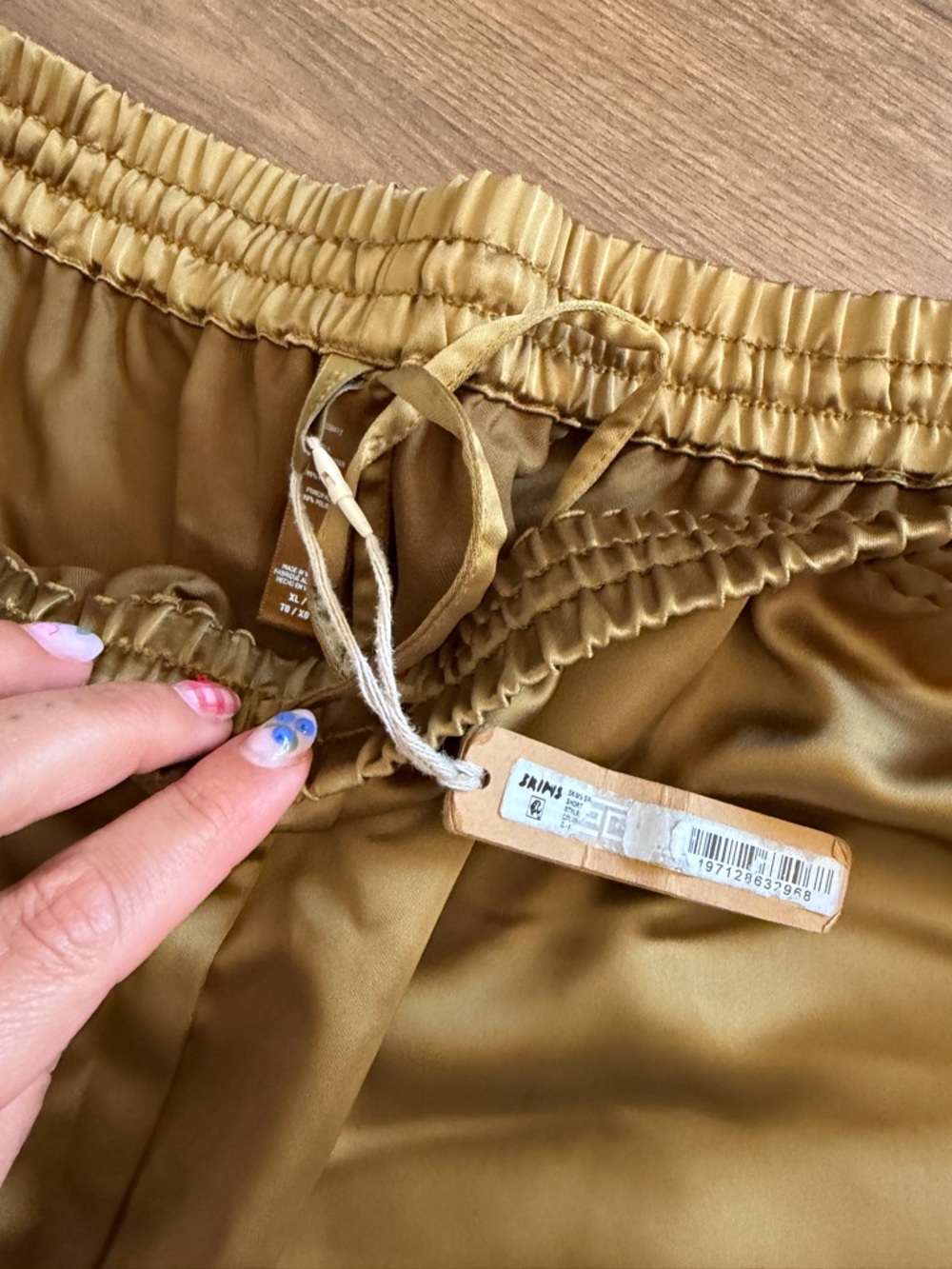 SKIMS Satin Athletic Shorts in Gold - Picture 5 of 6